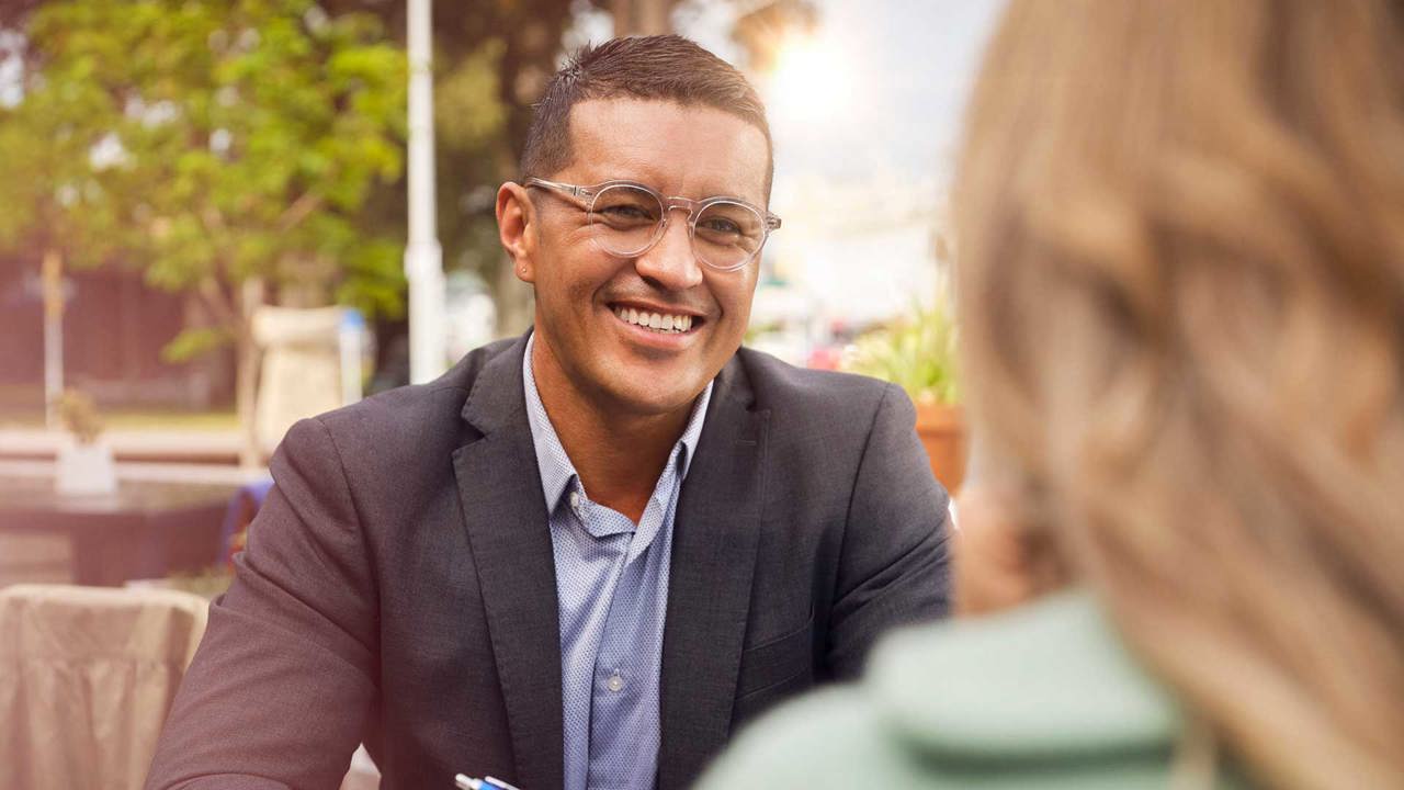 Adviser smiling at a customer Adviser smiling at a customer